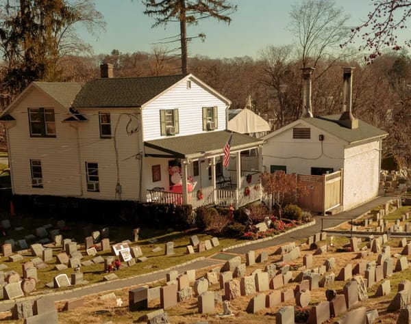 Who was the woman buried alone at the pet cemetery?